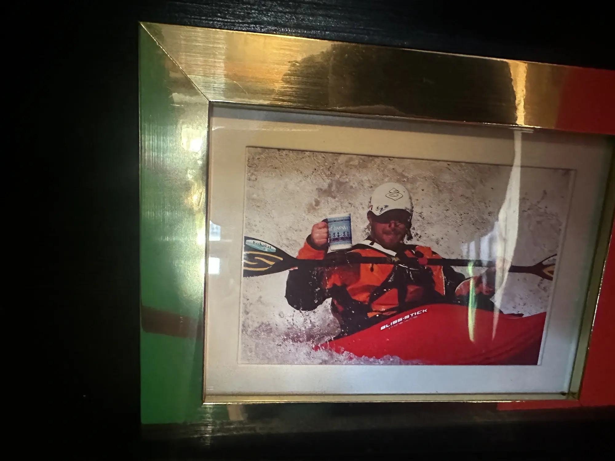 Picture of guy rafting with Cathedral Cafe mug