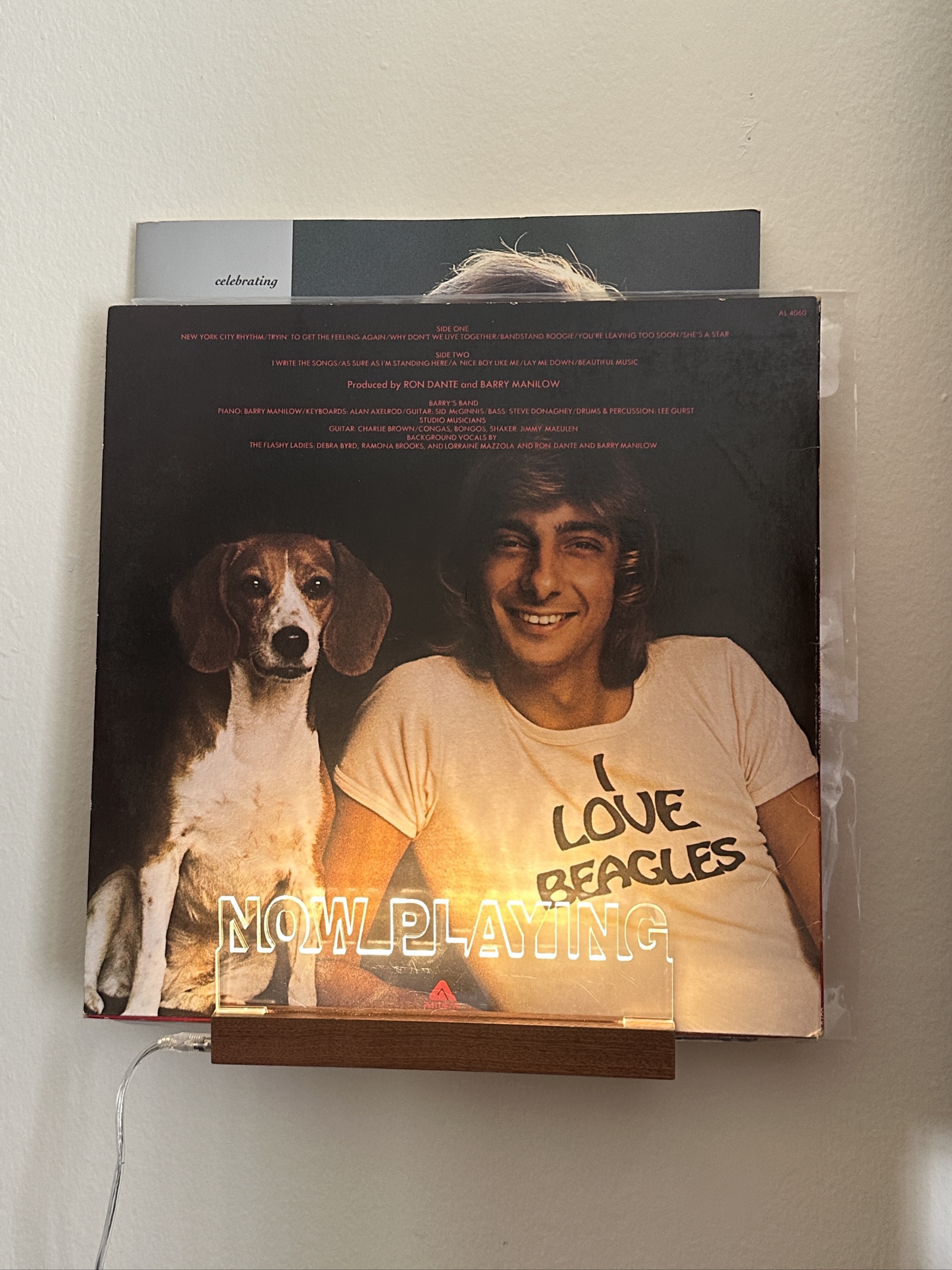 Listening to a record of Barry Manilow's "Tryin'...