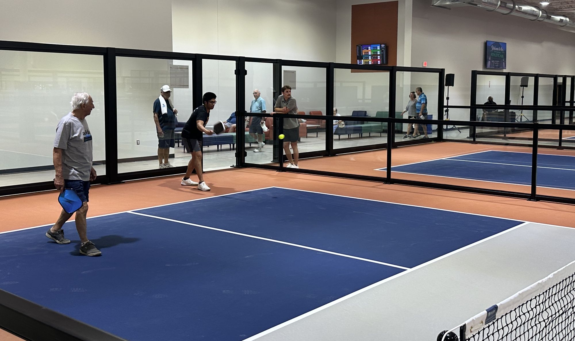 People playing pickleball