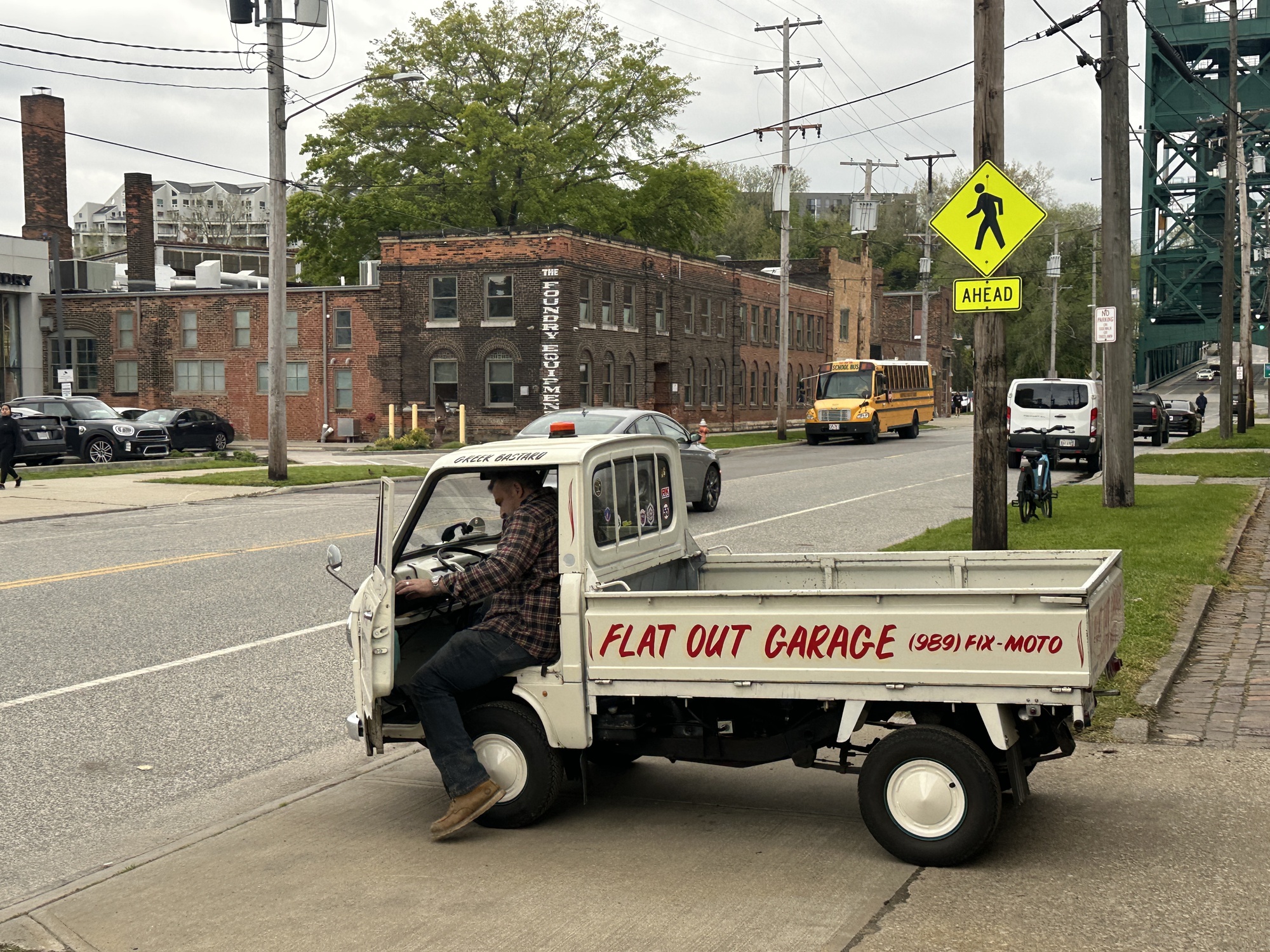 Guy getting into miniature truck