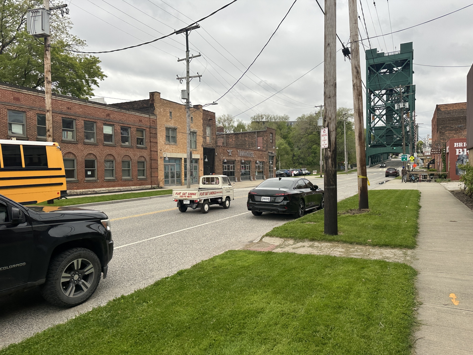 Guy driving miniature truck down the street