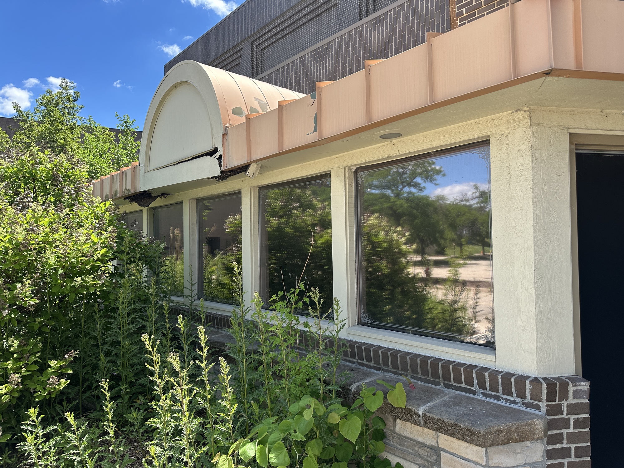 Overgrown booth