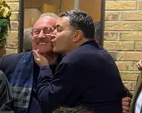 Dominic J. Moceri plants a kiss